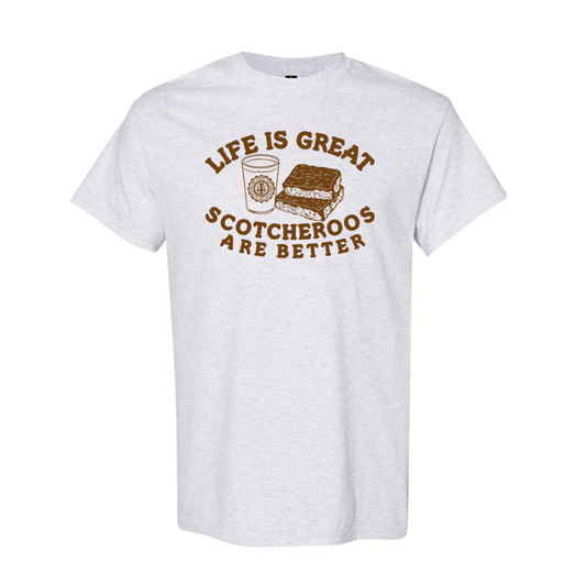 White t-shirt with brown graphic and text 'Life is great, scotcheros are better' on a white background