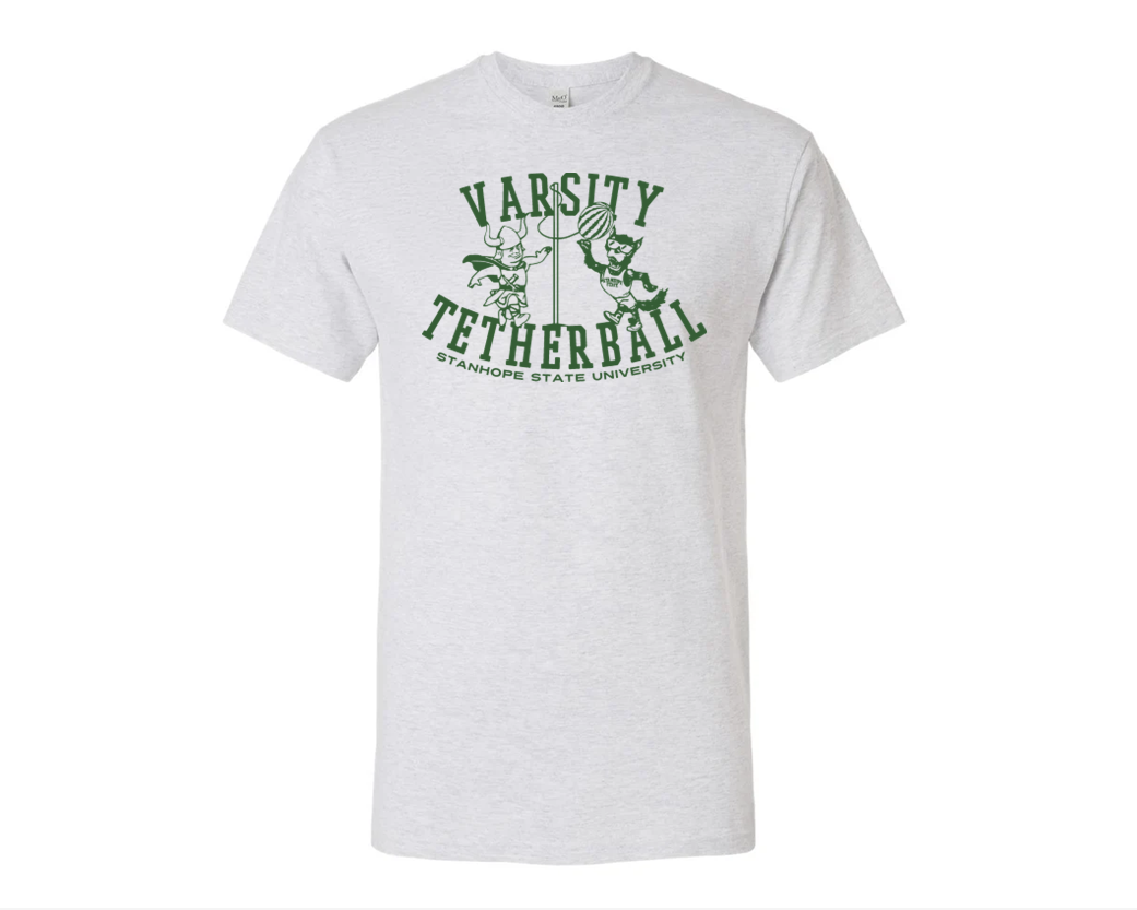 White t-shirt with green 'Varsity Tetherball' text and graphics on a white background